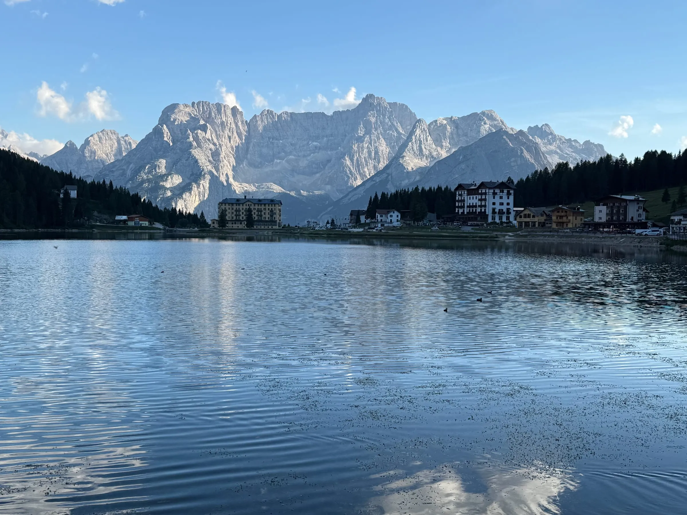 Lago di Misurina at dusk, hotels along the shore under the Sorapiss massif